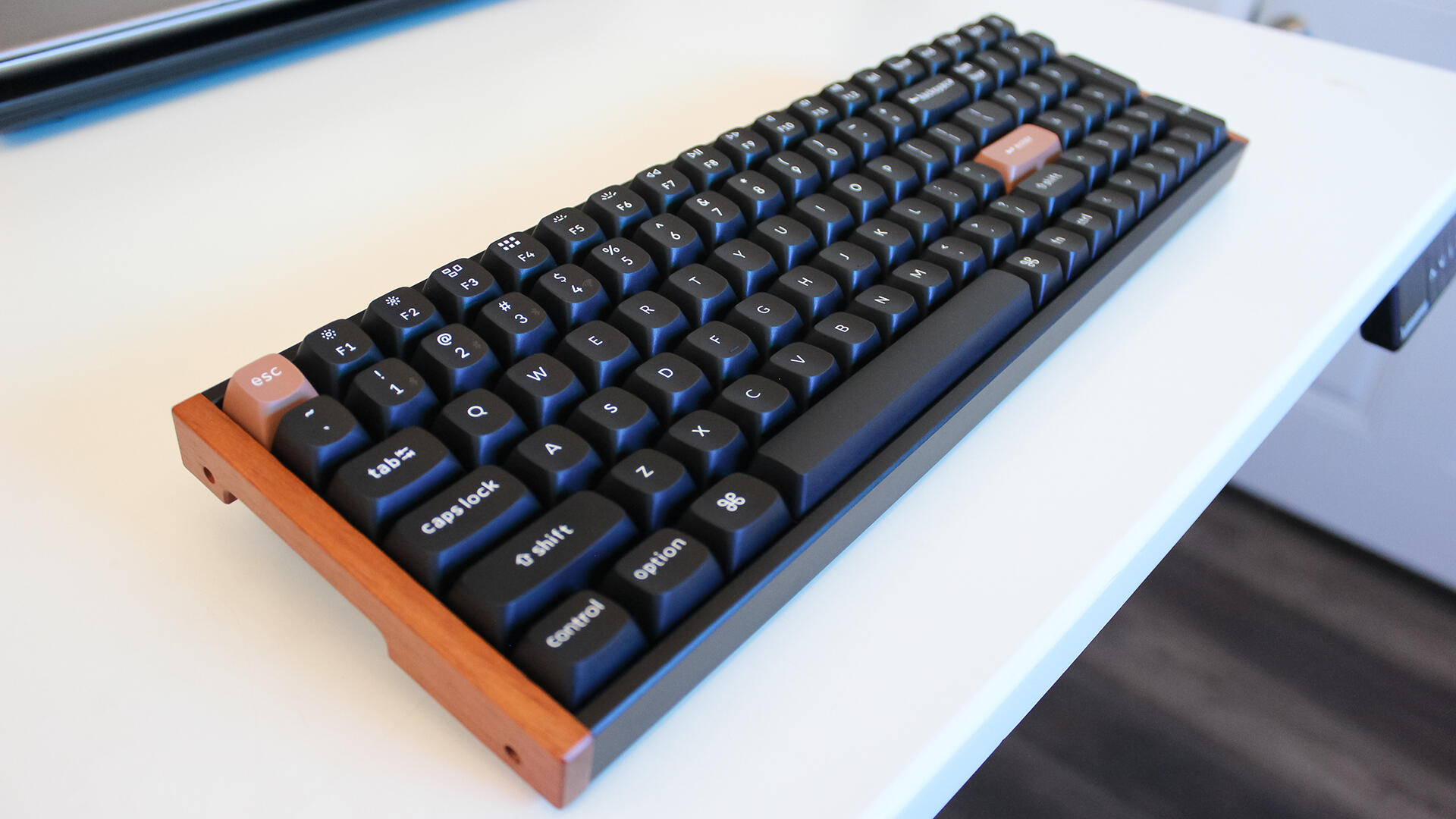 Keychron K4 HE keyboard on a white desk.