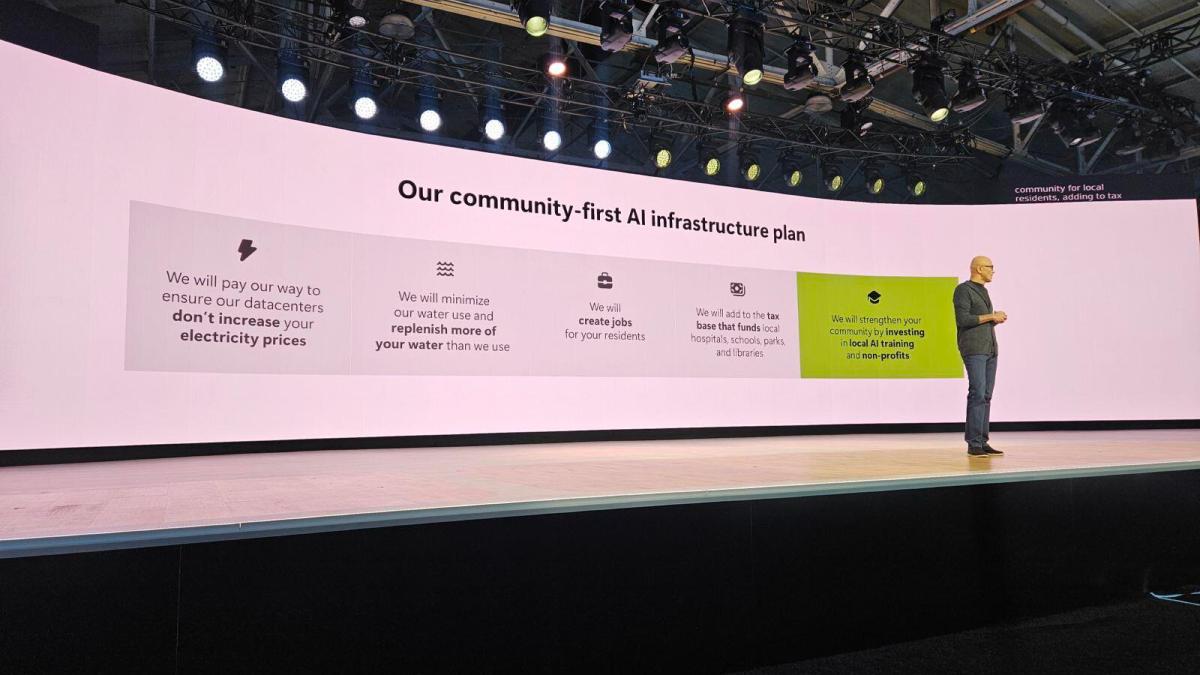 A photo of Microsoft CEO Satya Nadella on the Microsoft Build 2026 keynote stage talking about data centers