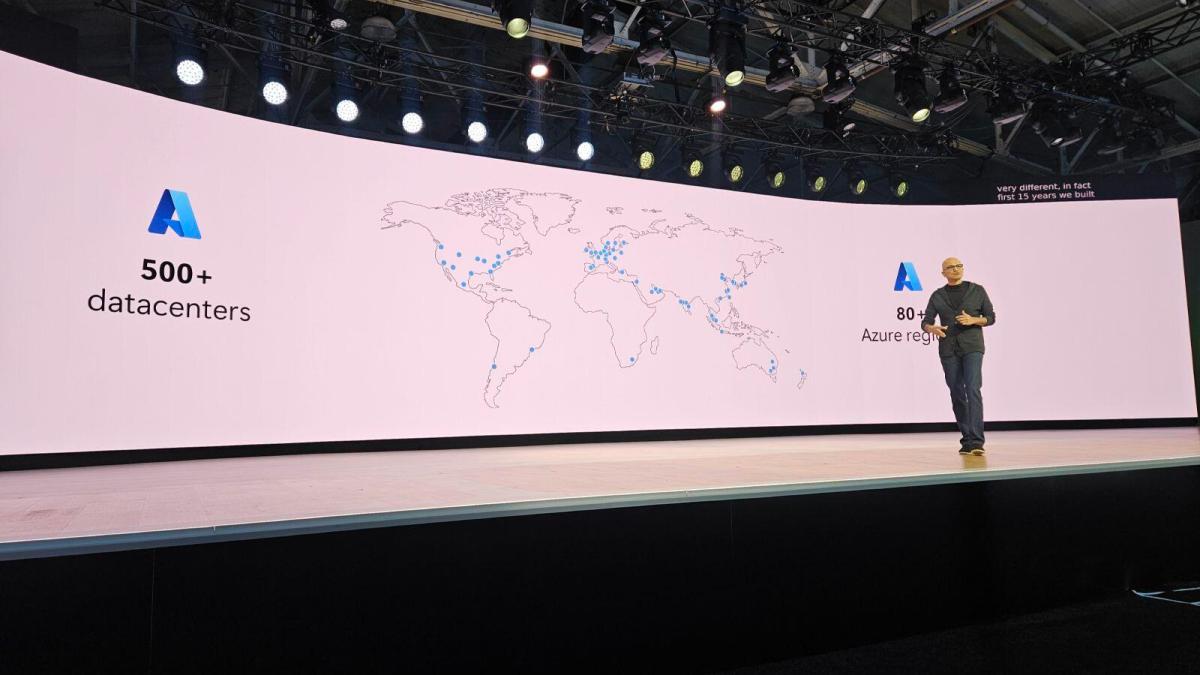 A photo of Microsoft CEO Satya Nadella on the Microsoft Build 2026 keynote stage talking about data centers