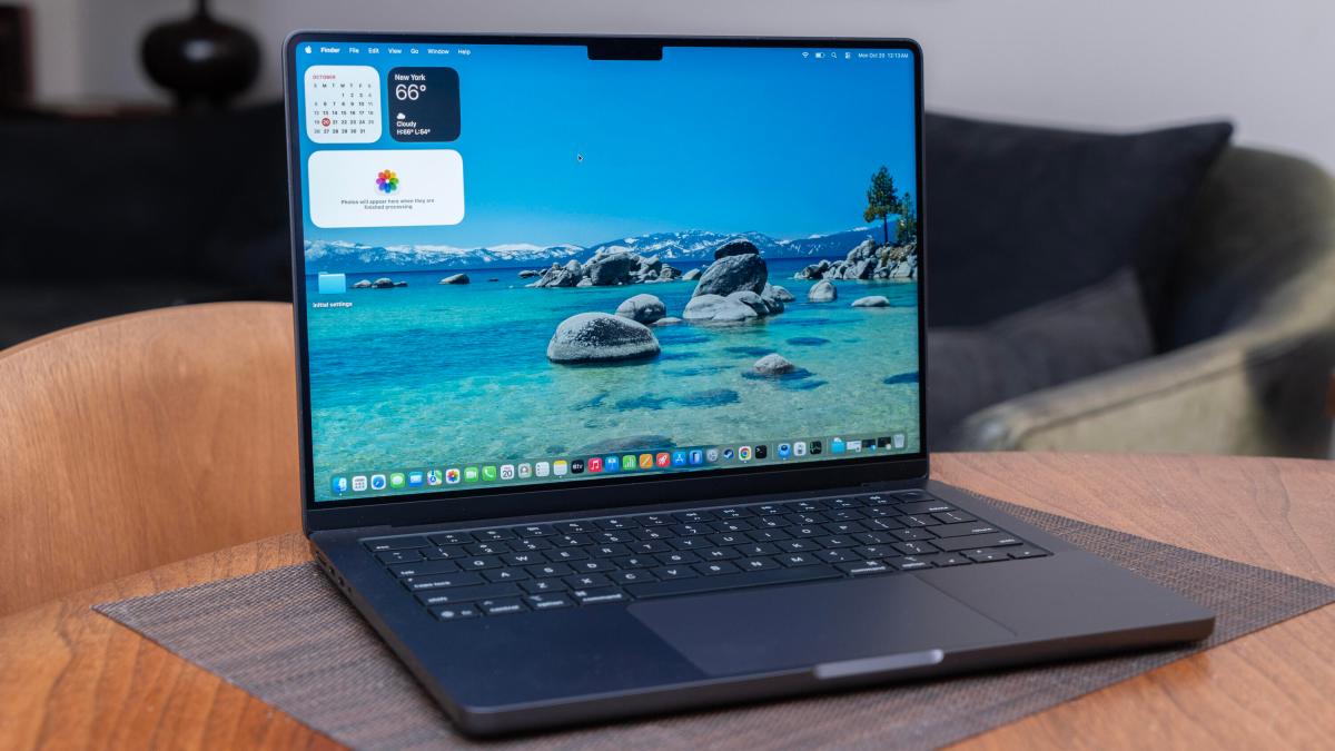 An Apple laptop on a table.